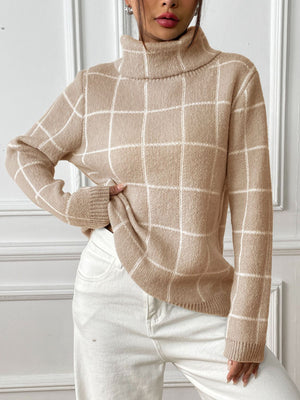 Tan grid-patterned turtleneck knit pullover sweater with long sleeves.