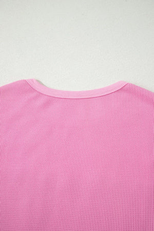 Pink waffle knit t-shirt with crew neck and pocket detail