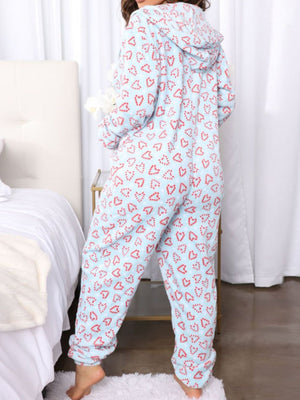 Light blue fleece onesie with red hearts pattern, hooded, long sleeve, full length.