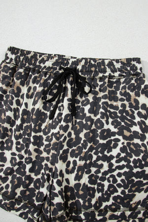 Leopard print lounge shorts with elastic waistband and drawstring.