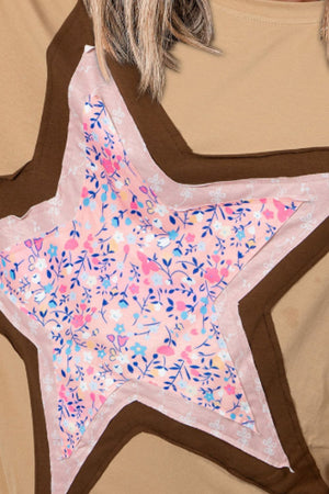 Tan cotton tee with a pink floral star patchwork detail and brown trim.