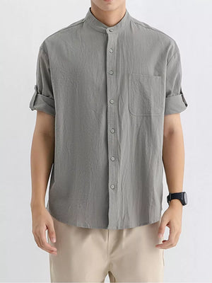 Men's gray textured short sleeve button-up shirt with mandarin collar and chest pocket