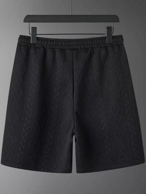 Black knit shorts with diamond pattern and elastic waistband
