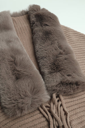 Faux fur collar knit cape in tan with fringe detail.