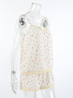 Floral lace trim cami and shorts set with adjustable straps and delicate pink floral print.