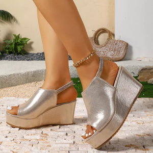 Gold high heel wedge sandals with peep toe and elastic slingback strap.