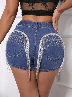 Medium wash denim shorts with crystal fringe detail on back pockets.