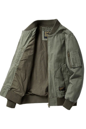Army green bomber jacket with patch detail and zippered sleeve pocket.