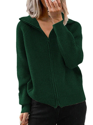 Green ribbed knit zip-up trench coat with collar and pockets.
