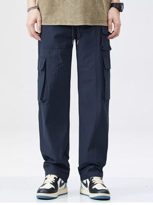 Dark blue utility cargo sweatpants for men with wide legs and multiple pockets.