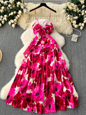Vibrant floral tiered cami maxi dress with a bow detail and spaghetti straps.