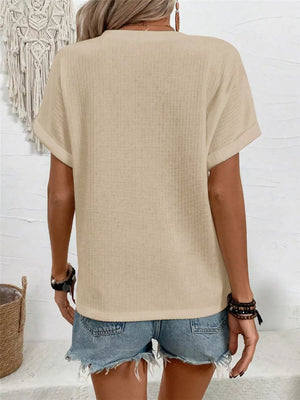 Apricot waffle knit V-neck t-shirt with cuffed short sleeves.