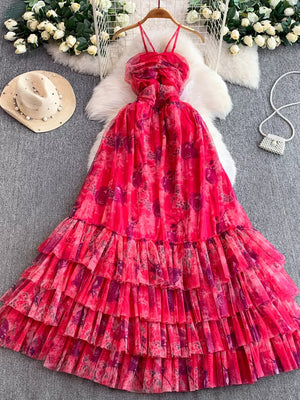 Pink floral mesh maxi dress with tiered ruffle skirt and ruched bodice.