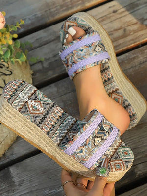 Woven platform slides in lavender with geometric pattern and espadrille sole.