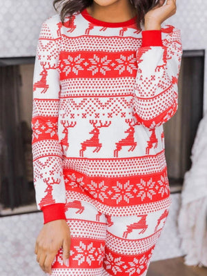 Festive reindeer knit lounge set in orange-red with snowflake pattern, crew neck, long sleeves.