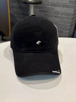 Black cotton baseball cap with embroidered E logo and curved brim