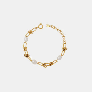 Gold knot and pearl link bracelet with adjustable chain closure