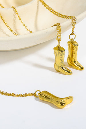 Gold cowboy boot charm necklace with intricate detailing on 18K gold-plated chain.