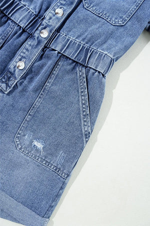 Medium wash denim romper with elastic waist, button-down front, and distressed pocket detail.