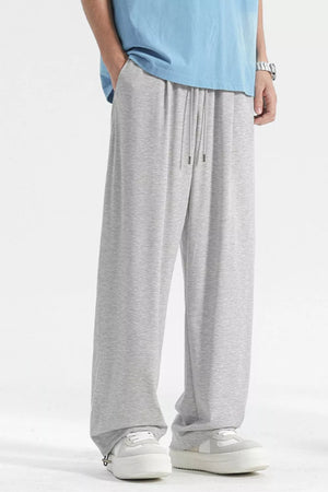 Light gray casual sweatpants with drawstring waist and relaxed fit.