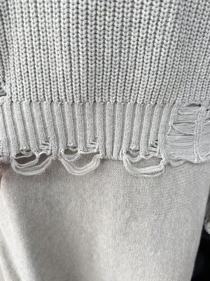 Light gray distressed cotton sweater set with deconstructed hem detail.