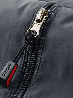Grey men's vest detail showing zipper with "SPORTS" tag