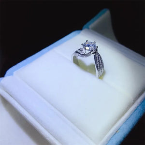 Silver swirl band ring with moissanite center stone and pave accents