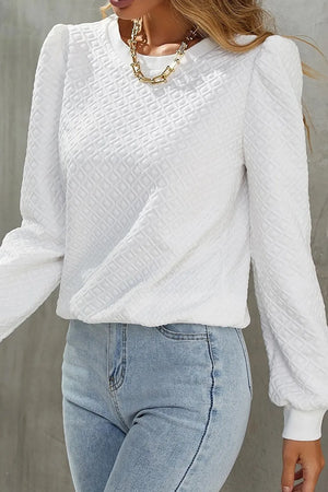 White textured puff sleeve crewneck pullover sweater with a diamond pattern.