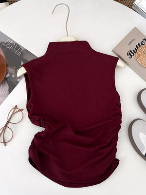 Wine red mock neck tank top with draped ruching detail on the side.