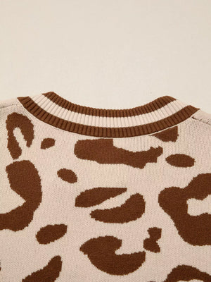 Chic leopard print knit sweater with a striped ribbed neckline.