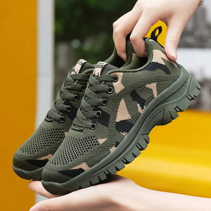 Camouflage mesh performance trainers in moss green with lace-up closure and athletic sole.