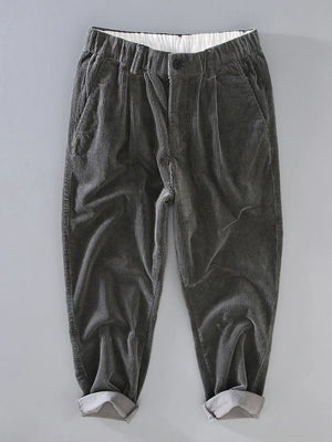 Smoky gray corduroy pleated casual pants with elastic waistband and cuffed hem.