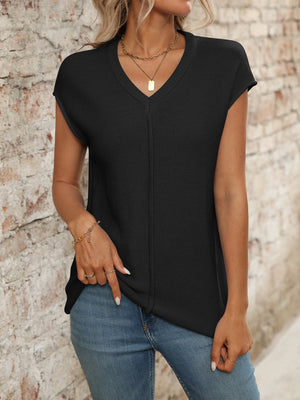 Black seamed knit sleeveless v-neck top with a casual fit.