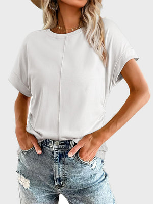 White seamed front ruched sleeve tee with crew neck and cuffed short sleeves.