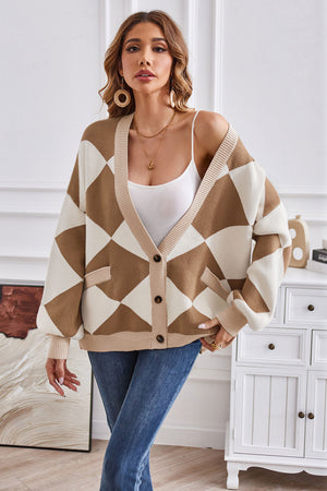Diamond knit balloon sleeve cardigan in camel and cream acrylic with button front and pockets.
