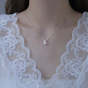 Silver swan pendant necklace with zircon accents on a delicate chain