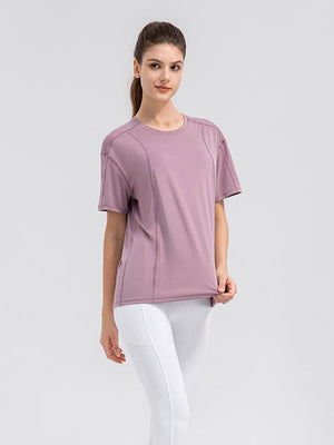 Dusty Pink performance tee with seam details and crew neck.