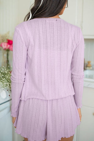 Lace trimmed knit lounge set in pink purple with eyelet pattern and scalloped hem.