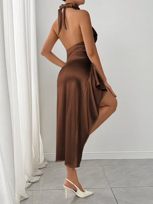 Brown satin halter dress with a thigh-high slit and tie back detail.