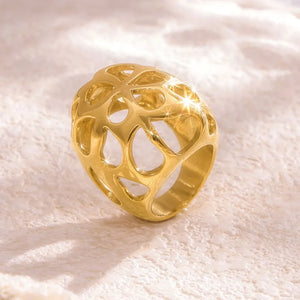 Gold openwork orb ring with a contemporary, hollow design.