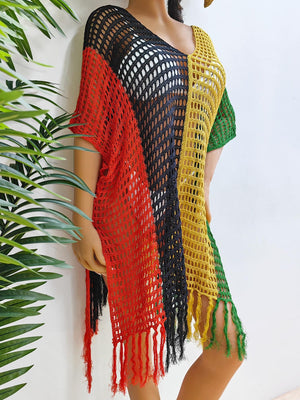 Colorblock crochet cover-up with fringe detail in red, black, yellow, and green.
