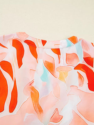 Vibrant abstract print mini dress with a round neckline and short sleeves, featuring a watercolor-style pattern in orange