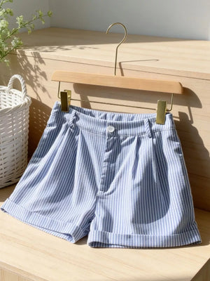 Blue and white striped chino shorts with cuffed hems and button closure.