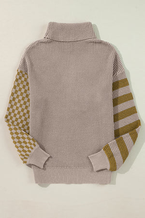 Checkerboard & stripe sleeve knit turtleneck sweater in mocha with a waffle knit body and ribbed cuffs.