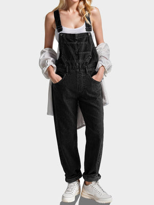 Relaxed black denim overalls with cross-back straps and a bib pocket.