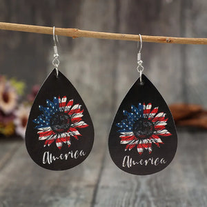 Black teardrop earrings with American flag sunflower design and "America" text