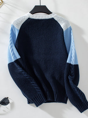 Chevron cable knit colorblock sweater in navy, light blue, and white with crew neck.