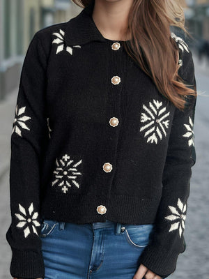 Black snowflake knit cardigan with pearl button details and a collared neckline.