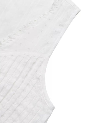 White lace-trimmed sleeveless maternity blouse with textured dot and stripe fabric.
