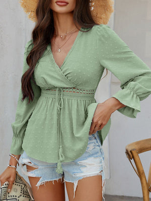 Gum Leaf Swiss dot blouse with lace trim, V-neck, tie waist, and ruffled cuffs.